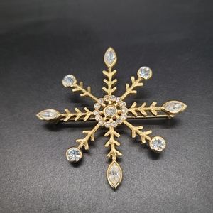 Napier Snowflake brooch. Gold-tone with Rhinestones.